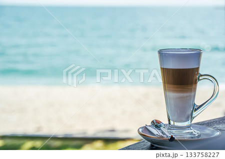 Layered Latte in Glass Cup by the Beach Layered Latte in Glass Cup by the Beach 133758227