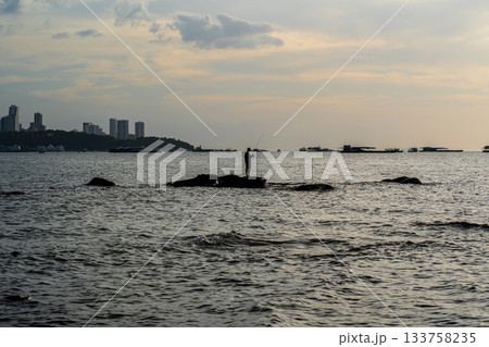 Fisherman on Coastal Rocks at Pattaya Fisherman on Coastal Rocks at Pattaya 133758235