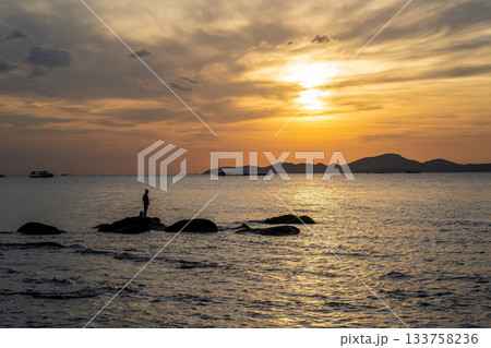 Sunset Fishing Scene on Coastal Rocks 133758236