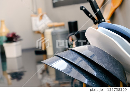 Detail image of Kitchen utensils on the table in a modern kitchen. 133758399
