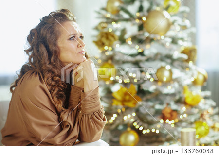 Woman\'s Thoughtful Worry During the Christmas Season Woman\'s Thoughtful Worry During the Christmas Season 133760038
