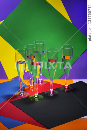 Still life with wine glasses on a colored background Still life with wine glasses on a colored background 133760754