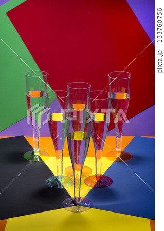Still life with wine glasses on a colored background Still life with wine glasses on a colored background 133760756