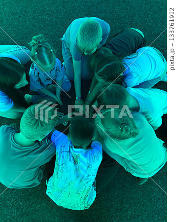 Children forming a circle with hands together unity concept Children forming a circle with hands together unity concept 133761912