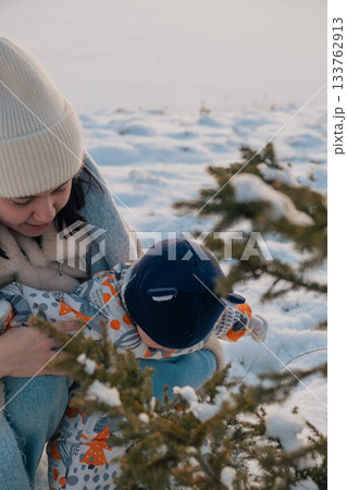 Mother and Baby in Winter Wonderland Mother and Baby in Winter Wonderland 133762913