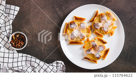 Mini baked pineapple tarts on a plate on the table top view web banner Mini baked pineapple tarts on a plate on the table top view web banner 133764622