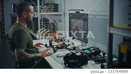 Technician Integrating Physical Drone With Digital Design Schematics 133764999