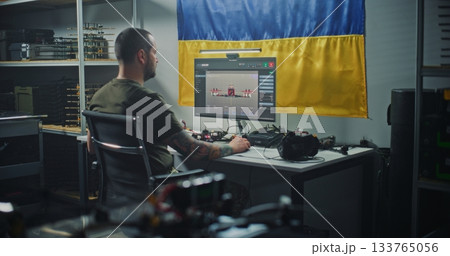 Ukrainian Engineer With Tattoos Checks Modern FPV Drone Using Compute 133765056