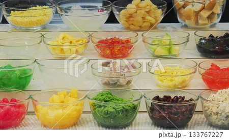 Colorful Thai Dessert Toppings, Ingredients displayed in glass bowls. Assortment for Ruam Mit (mixed dessert). Colorful Thai Dessert Toppings, Ingredients displayed in glass bowls. Assortment for Ruam Mit (mixed dessert). 133767227