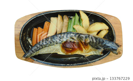 Grilled Mackerel (Saba Fish) steak on a sizzling plate with mixed vegetables. Japanese Teriyaki or Shioyaki style. Isolated on white. Grilled Mackerel (Saba Fish) steak on a sizzling plate with mixed vegetables. Japanese Teriyaki or Shioyaki style. Isolated on white. 133767229