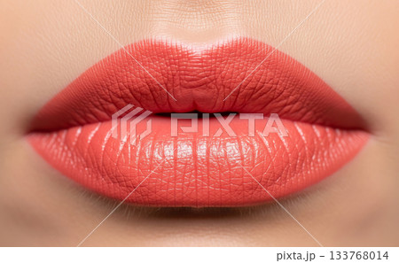 Beautiful coral lipstick on perfect lips 133768014