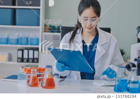 Portrait, science and happy woman on laptop in lab to research chemistry, test or innovation. Microscope, scientist and face of medical doctor in goggles for microbiology, healthcare or pharma study Portrait, science and happy woman on laptop in lab to research chemistry, test or innovation. Microscope, scientist and face of medical doctor in goggles for microbiology, healthcare or pharma study 133768284