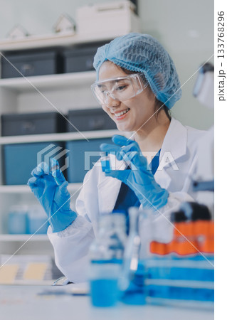 Portrait, science and happy woman on laptop in lab to research chemistry, test or innovation. Microscope, scientist and face of medical doctor in goggles for microbiology, healthcare or pharma study Portrait, science and happy woman on laptop in lab to research chemistry, test or innovation. Microscope, scientist and face of medical doctor in goggles for microbiology, healthcare or pharma study 133768296