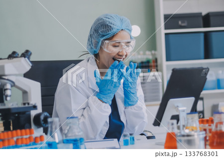 Portrait, science and happy woman on laptop in lab to research chemistry, test or innovation. Microscope, scientist and face of medical doctor in goggles for microbiology, healthcare or pharma study Portrait, science and happy woman on laptop in lab to research chemistry, test or innovation. Microscope, scientist and face of medical doctor in goggles for microbiology, healthcare or pharma study 133768301