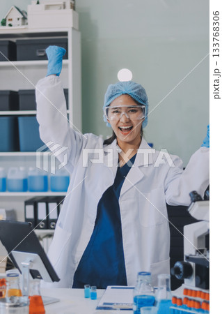 Portrait, science and happy woman on laptop in lab to research chemistry, test or innovation. Microscope, scientist and face of medical doctor in goggles for microbiology, healthcare or pharma study Portrait, science and happy woman on laptop in lab to research chemistry, test or innovation. Microscope, scientist and face of medical doctor in goggles for microbiology, healthcare or pharma study 133768306