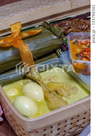 Opor Ayam, Indonesian Chicken Coconut Curry with Eggs and Lontong Opor Ayam, Indonesian Chicken Coconut Curry with Eggs and Lontong 133768381