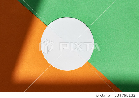 Geometric abstract composition with green, orange, and white circle 133769132