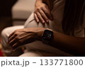 Pregnant woman measuring heart rate with her watches. 133771800