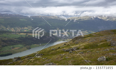 View of Lake Vagavatnet from Kleivhoe Mountain in Randen, Norway on a cloudy day 133771855