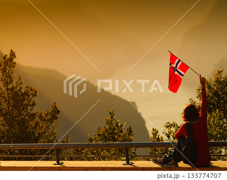 Tourist enjoy fjord view on Stegastein viewpoint Norway Tourist enjoy fjord view on Stegastein viewpoint Norway 133774707