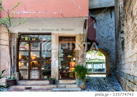 Moustiers Sainte Marie, France - Sep 22, 2025: The narrow streets of the old village Moustiers Sainte Marie in France 133774743