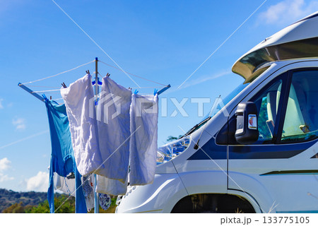 Camping. Clothes hanging to dry by camper rv. 133775105