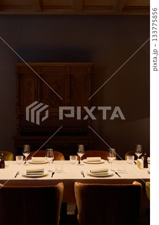 elegant table prepared for private meal, refined ambiance with fine dining elements and soft lighting elegant table prepared for private meal, refined ambiance with fine dining elements and soft lighting 133775856