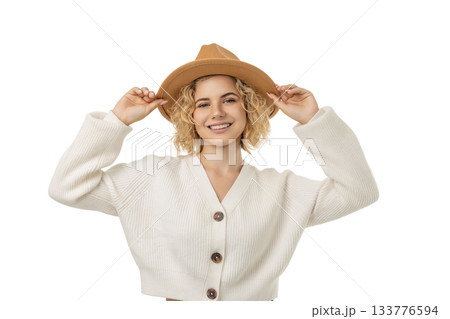 Smiling woman in a festive hat enjoys winter, isolated, PNG 133776594