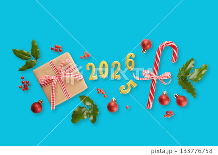 Decorations include candy canes on a bright blue surface 133776758