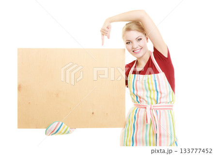 housewife holds wooden board with copy space 133777452