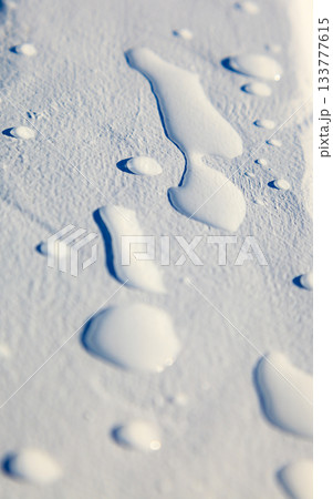 closeup on raindrops water drops on white plank closeup on raindrops water drops on white plank 133777615
