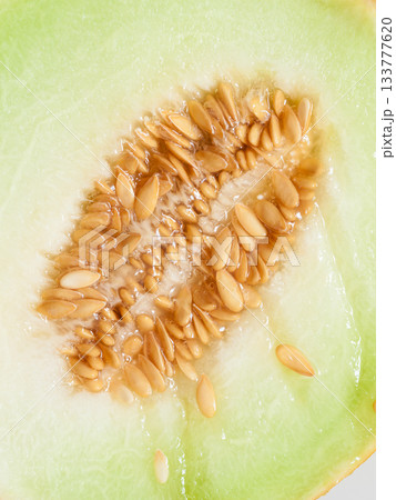 Closeup melon with pips as food background. Closeup melon with pips as food background. 133777620