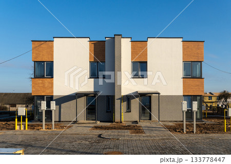 New modern two-story townhouse building exterior 133778447