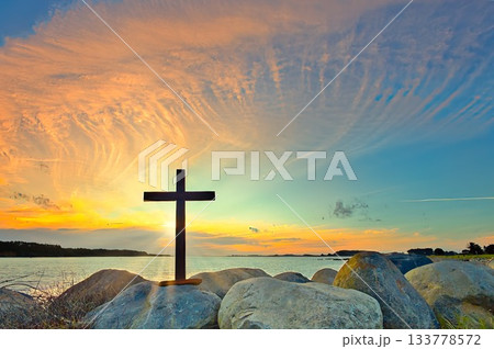 Dark Cross On The Rocks Sunset 133778572