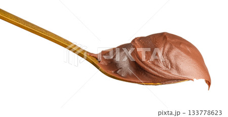 Spoonful of creamy chocolate spread on a golden spoon isolated on white background, captured in detailed studio macro style for dessert advertising, confectionery branding, packaging design 133778623