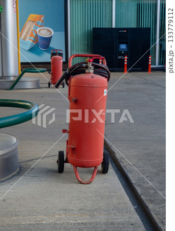Gas cylinder for refueling cars. Refueling. Gas cylinder in the city. Gas cylinder for refueling cars. Refueling. Gas cylinder in the city. 133779112