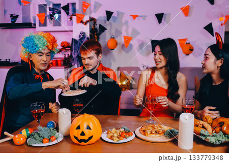 Joyful office Halloween party with coworkers in costumes, celebrating with drinks and laughter, fostering teamwork and festive spirit Joyful office Halloween party with coworkers in costumes, celebrating with drinks and laughter, fostering teamwork and festive spirit 133779348