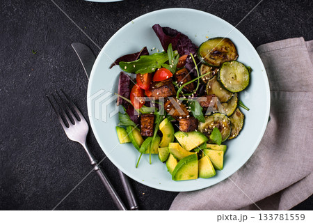 Healthy vegan keto salad with tofu and avocado 133781559