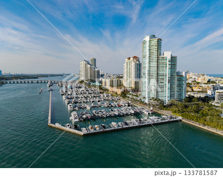 Port with yacht. Yachting marina. Luxury yacht charter. Miami port marina. Luxury yachting in summer. Docked yacht in port of Miami. Marina luxury cityscape. Docked boats at marina Port with yacht. Yachting marina. Luxury yacht charter. Miami port marina. Luxury yachting in summer. Docked yacht in port of Miami. Marina luxury cityscape. Docked boats at marina 133781587