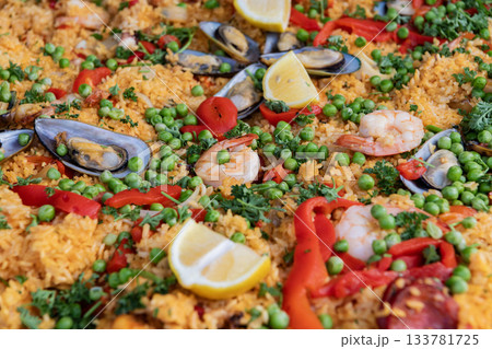 Spanish cuisine. Traditional rice seafood paella. Dish of Spain, seafood paella background. Spanish paella with shrimps, culinary recipe. Rice food dish. Rice risotto. Paella seafood. Luxury food 133781725