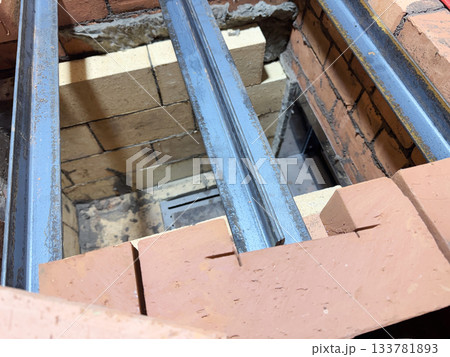 Installation of the heating stove ceiling with bricks on metal angles. Construction of a heating stove. 133781893