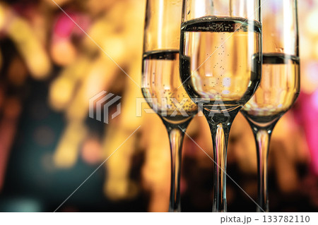 Two glasses of champagne against a backdrop of fireworks 133782110