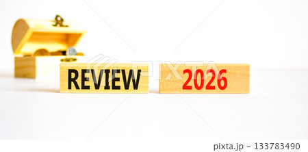 Review 2026 symbol. Concept words Review 2026 on beautiful wooden blocks. Beautiful white paper background. Beautiful wooden chest with coins. Business and review 2026 concept. Copy space. Review 2026 symbol. Concept words Review 2026 on beautiful wooden blocks. Beautiful white paper background. Beautiful wooden chest with coins. Business and review 2026 concept. Copy space. 133783490