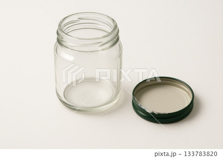 Empty glass jar with lid open. Space for text. Empty glass jar with lid open. Space for text. 133783820