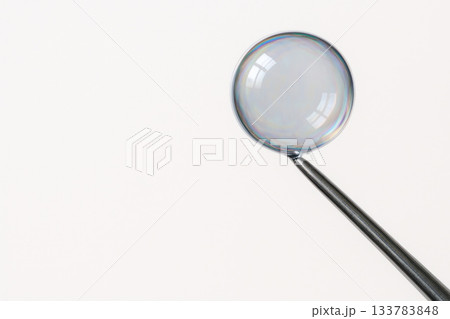 Close-up of a soap bubble on a metal stick. Space for text. 133783848