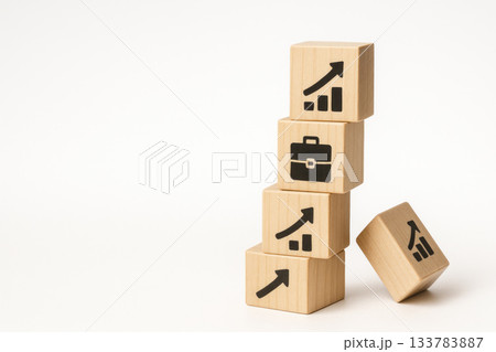 Wooden cubes with height arrows and a briefcase icon. Space for text. 133783887