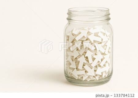 A glass jar full of white upward arrows, symbolizing growth. Space for text. A glass jar full of white upward arrows, symbolizing growth. Space for text. 133784112
