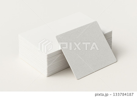 A stack of white cards with one facing forward. Space for text. 133784187