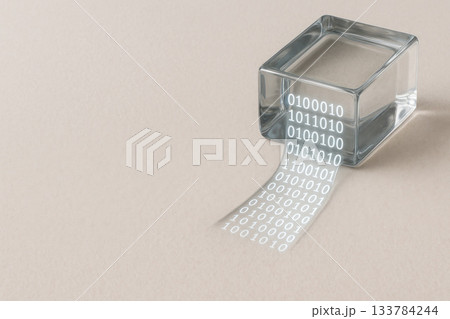 A glass cube with a binary code ribbon. Space for text. 133784244