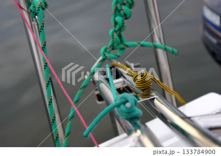 Knot of yacht ropes in different colors green and yellow 133784900